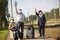 elderly seniors people with face masks waiting train before traveling during a pandemic