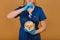 Elderly sick ill woman hold two pills on hand pouring capsules from medication bottle take painkiller supplement