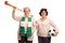 Elderly soccer fans with a football and a trumpet