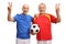 Elderly soccer players making victory signs