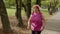 Elderly sport runner woman training. Workout cardio in park. Active senior people. Fitness