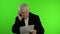 Elderly stylish caucasian grandfather man dissatisfied talking on mobile phone