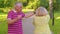 Elderly stylish couple family grandmother grandfather dancing walking listening music in summer park