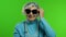 Elderly stylish grandmother. Caucasian woman posing on chroma key background