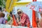 Elderly supporter with sunglasses at the World Orienteering Championships in Lausanne, Switzerland