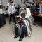 An elderly synagogue prayer holds Torah scrolls at bar mitzvah ceremony. Beer-Sheva, Israel. Beit-Habad DEC-24-2018