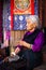 Elderly Tibetan Buddhist lady of Boudhanath Temple, Kathmandu, Nepal