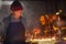 Elderly Tibetan watching butter lamps. On March 9, 2017, Kathmandu. Nepal.