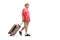 Elderly tourist walking and pulling a suitcase