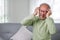 Elderly upset with headache, Senior constipation hand touch head