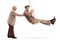 Elderly wife pushing her husband on a swing