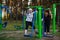 An elderly woman with an adult daughter is doing exercises on the sport playground