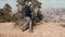 Elderly Woman With A Backpack Hiking In The Mountains Of The Grand Canyon Park