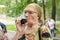 Elderly woman blowing into device for measuring volume of the lungs with disposable nozzle