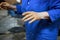 An elderly woman came to study pottery and ceramics. Hands in red clay. training, reportage