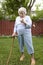 Elderly Woman with Cane Shaking Finger