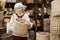 Elderly woman choosing basket in store