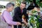 Elderly woman choosing bouquet