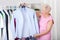 Elderly woman choosing an outfit