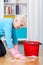 Elderly woman cleaning floor