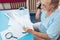 Elderly woman contacting custumer services after recieving a bill