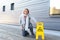 Elderly woman crawling on her knees after slipping