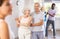 Elderly woman dancing merengue with male partner in latin dance class