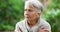 Elderly woman, dementia or anxiety in park with stress, worry and paranoid while sitting outdoor. Senior, retirement and