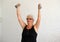 elderly woman doing exercises with dumbbells