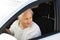 Elderly woman driving car