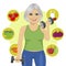 Elderly woman with dumbbells and variety of healthy vegetables
