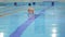 Elderly woman enjoys swimming in the pool