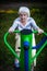 Elderly woman exercise on the street sport playground. Morning.