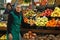 Elderly woman at a fruit stall in Portugal