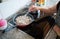 Elderly woman frying meatballs