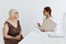 elderly woman with glasses examination by a doctor doctor assistant