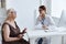 elderly woman with glasses examination by a doctor stethoscope