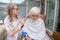 Elderly woman has hair cut by her carer during Corona virus lockdown at home
