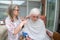 Elderly woman has hair cut by her carer during Corona virus lockdown at home