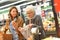 Elderly woman and her daughter at grocery store