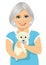 Elderly woman with her kind little labrador puppy