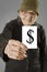 Elderly woman holding card with printed dollar mark.