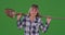 Elderly woman holding shovel on green chroma key composite