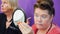 Elderly woman looking to mirror and applying makeup with cosmetic brush