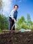 Elderly woman loose soil rake