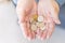 Elderly woman in money in her hands, grandmother holds money