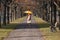 Elderly woman in the park with umbrella