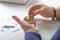 An elderly woman pensioner counts ukrainian coins money