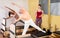 Elderly woman performing pilates exercises on reformer during group workout