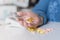 Elderly woman with pills hand, grandmother with medicines